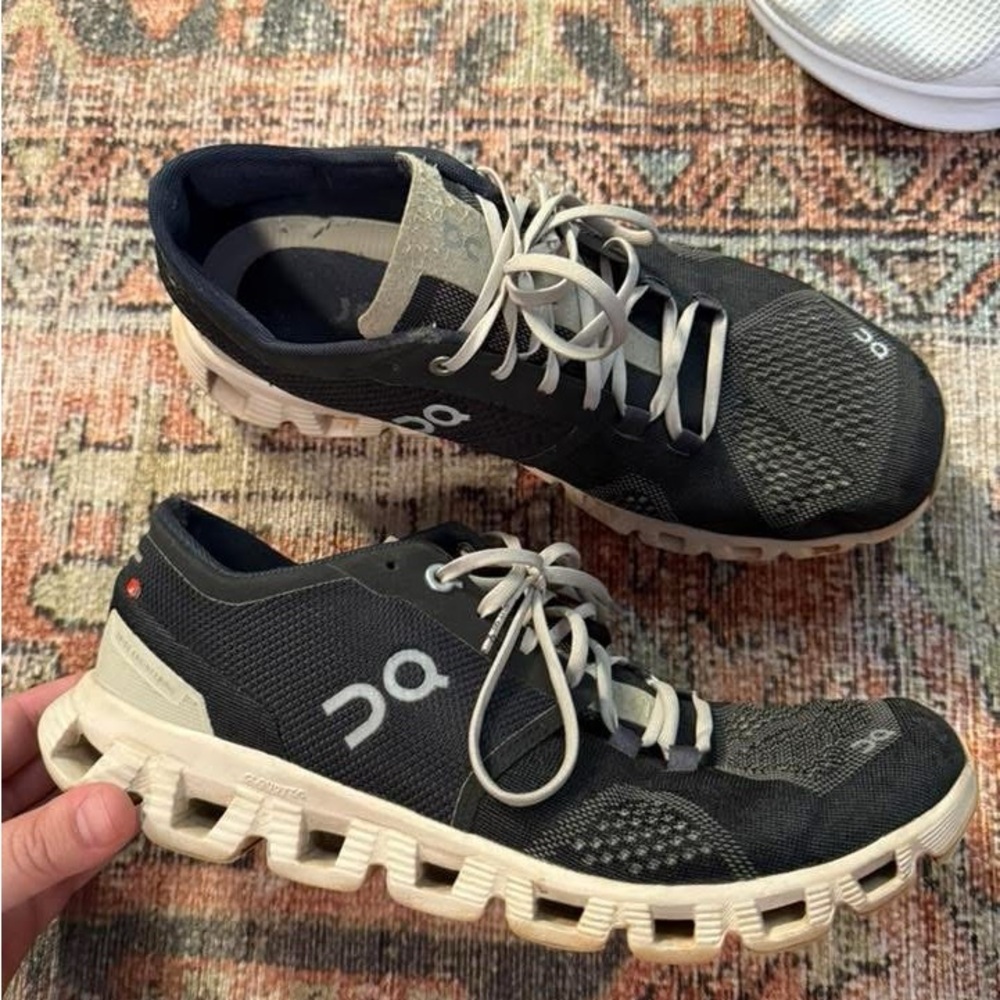 On Clouds Running Dark Gray and White Athletic Shoes